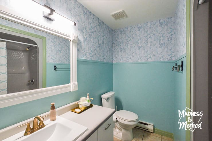 teal bathroom walls with wallpaper