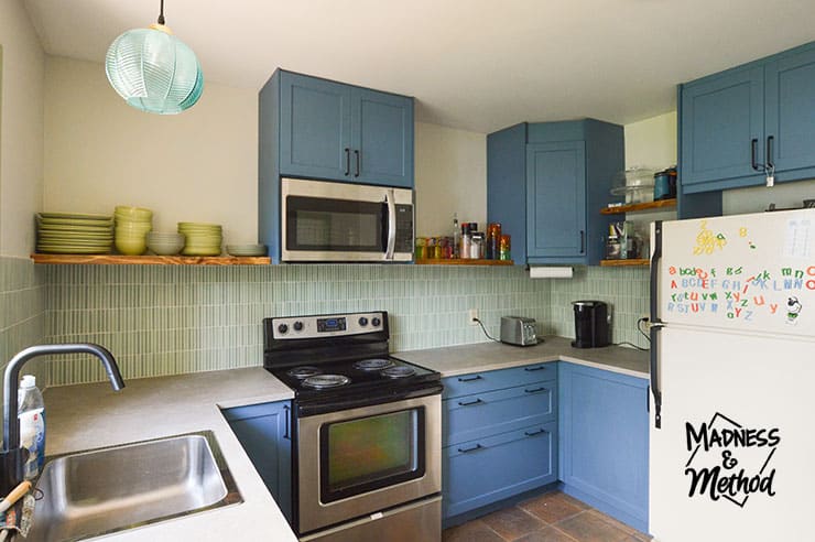 blue cabinets with open shelves