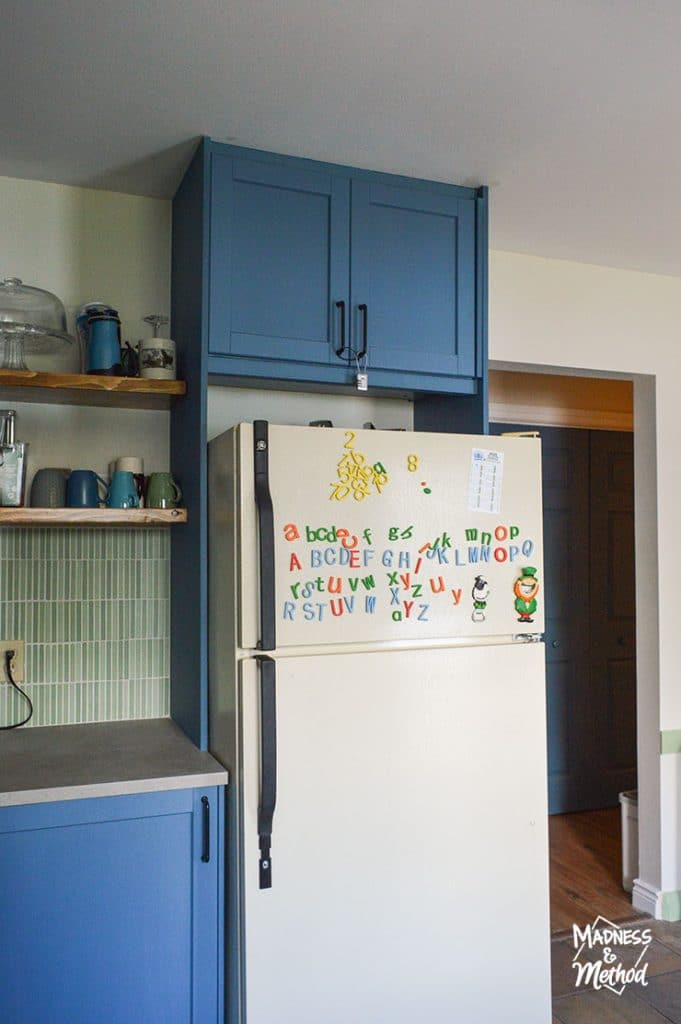 cabinet above fridge